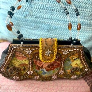 Beautiful top handle, embroidered and beaded handbag. Show off this unique bag